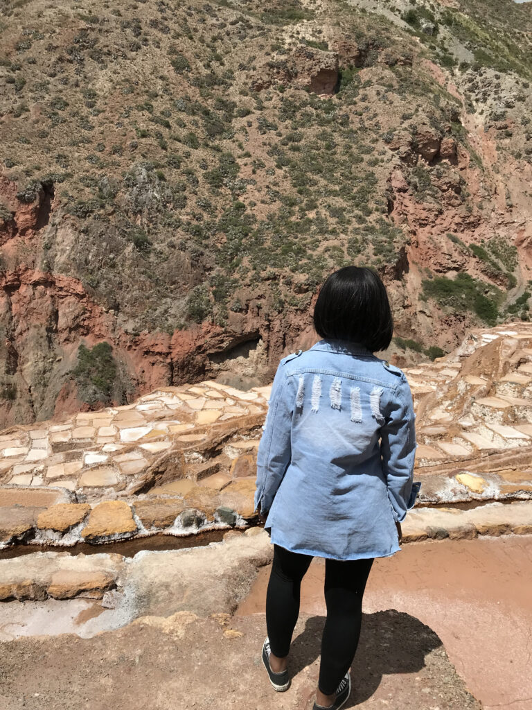 Woman overlooking Mara Salt Mines